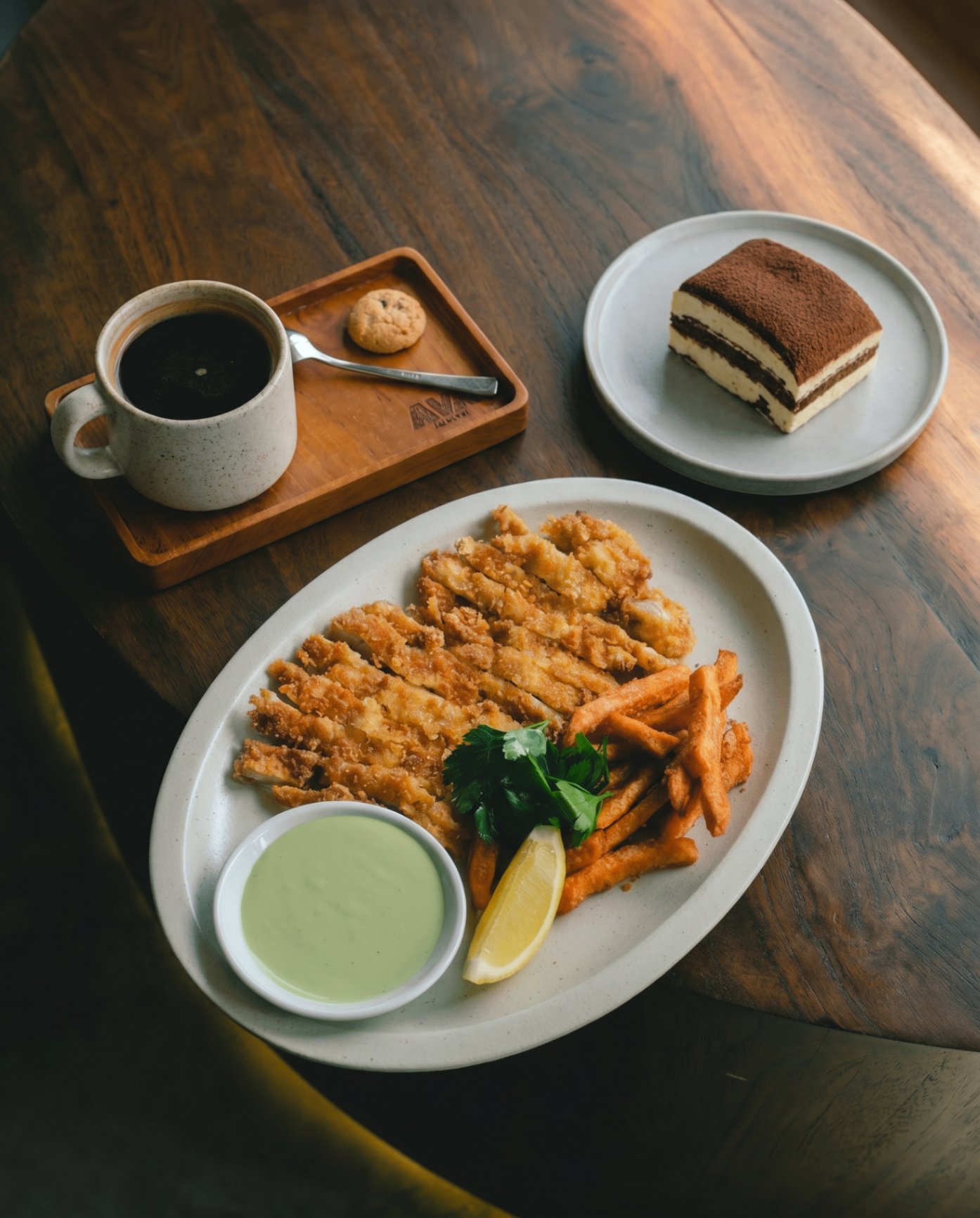 Chicken schnitzel with sweet-potato fries, tiramisu and coffee at AVA Bistro, the best restaurant in Seseh